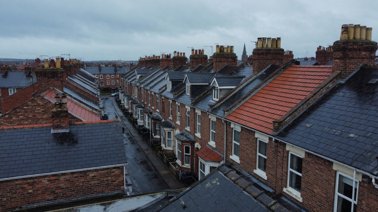 Wet slate and tile rooftops on a North West terrace street